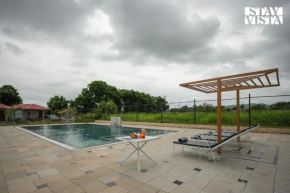 StayVista at Wildwoods Stone with Pool, Bathtub, Wi-Fi